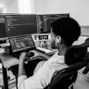 Dagim working at his desk